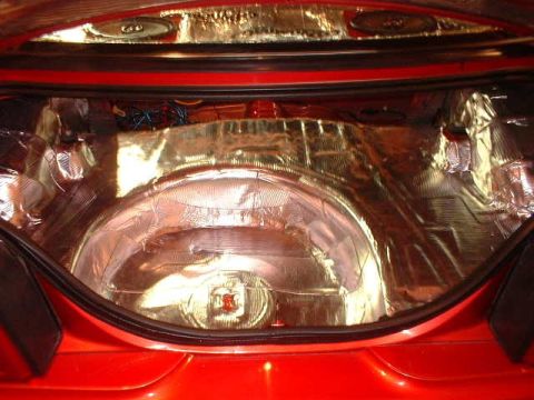 1994 Ford Mustang - Sound deadening material installed in the trunk of a 1994 Ford Mustang.