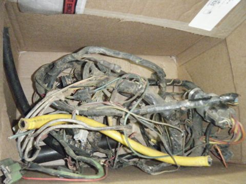1978 Ford Bronco - A messy bundle of wires and connectors, likely an old vehicle wiring harness.