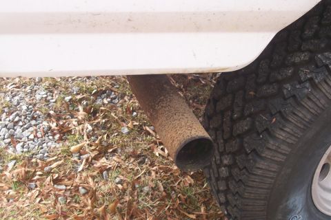 1992 Ford C-350 (Centurion Conversions) - Exhaust pipe and tire detail.