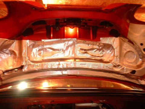 1994 Ford Mustang - Sound deadening material is applied inside the trunk of a vehicle.