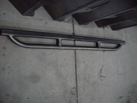 1993 Ford Bronco - These custom steel rock sliders feature a curved step design with additional support bars for enhanced durability and protection.