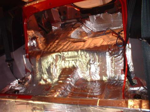 1994 Ford Mustang - Sound deadening material is applied to the interior floor and rear of a vehicle.