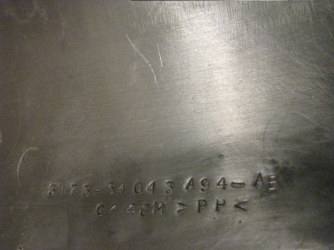 2004 Ford Crown Victoria - Embossed part number and text visible on a dark surface, with a Supermotors watermark.