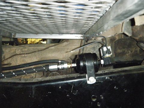 1978 Ford Bronco - Close-up view of aftermarket fuel system components installed on a vehicle.