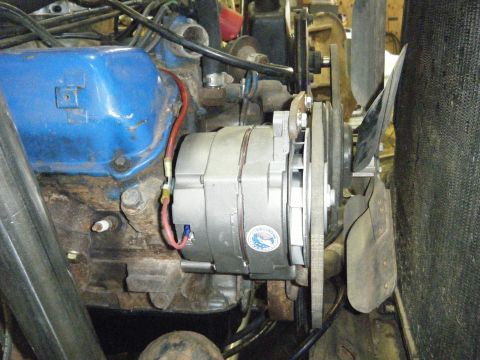 1978 Ford Bronco - Engine bay view showing alternator, fan, and part of the valve cover.