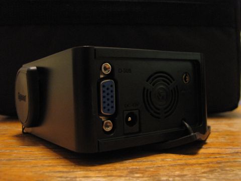 1984 Ford Bronco - The rear panel of a projector displays various input and power connections, along with a cooling fan.