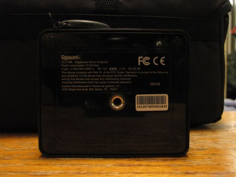 1984 Ford Bronco - The back of a Gigaware Micro Projector shows its model number, power specifications, and FCC/CE compliance information.