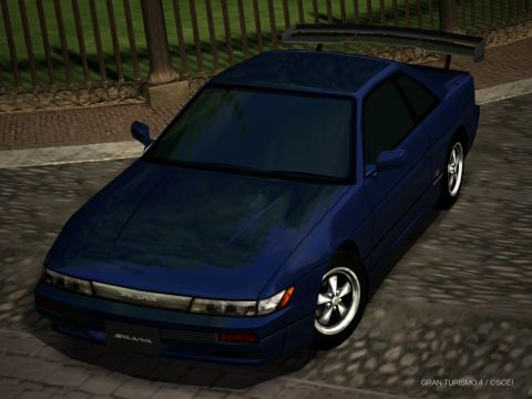 2000 Mercury Grand Marquis - This blue coupe features a prominent rear spoiler and 'SILVIA' badging on the front grille.