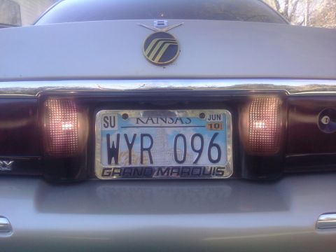 2000 Mercury Grand Marquis - Rear view of a silver Mercury Grand Marquis, displaying a Kansas license plate.