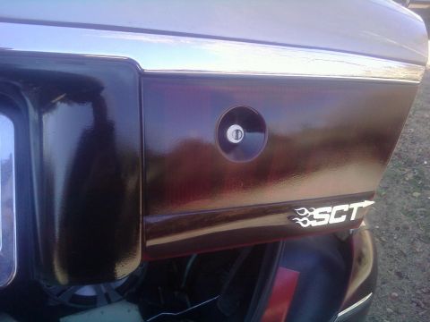 2000 Mercury Grand Marquis - Car's rear panel with gas cap and SCT decal visible.