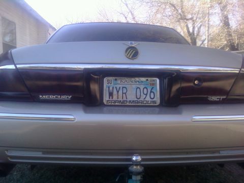 2000 Mercury Grand Marquis - The rear of a silver 2000 Mercury Grand Marquis is shown, displaying its license plate and taillights.