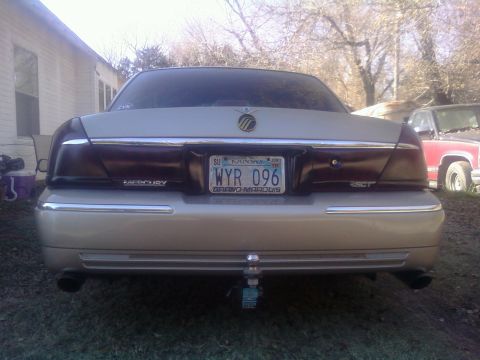 2000 Mercury Grand Marquis - Rear view of a beige sedan, identified as a Grand Marquis, with a Kansas license plate.