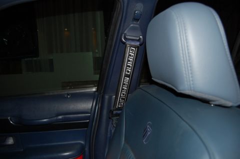 1985 Mercury Grand Marquis - Seat belt strap displays "GRAND MARQUIS" text, indicating it's a car part.