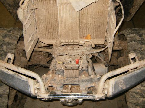 2000 Ford E350 - Undercarriage view of a vehicle, revealing the radiator, winch, and front bumper components.