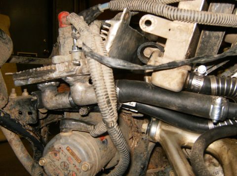 2000 Ford E350 - Detail of a vehicle's engine compartment, showing various parts and connections.