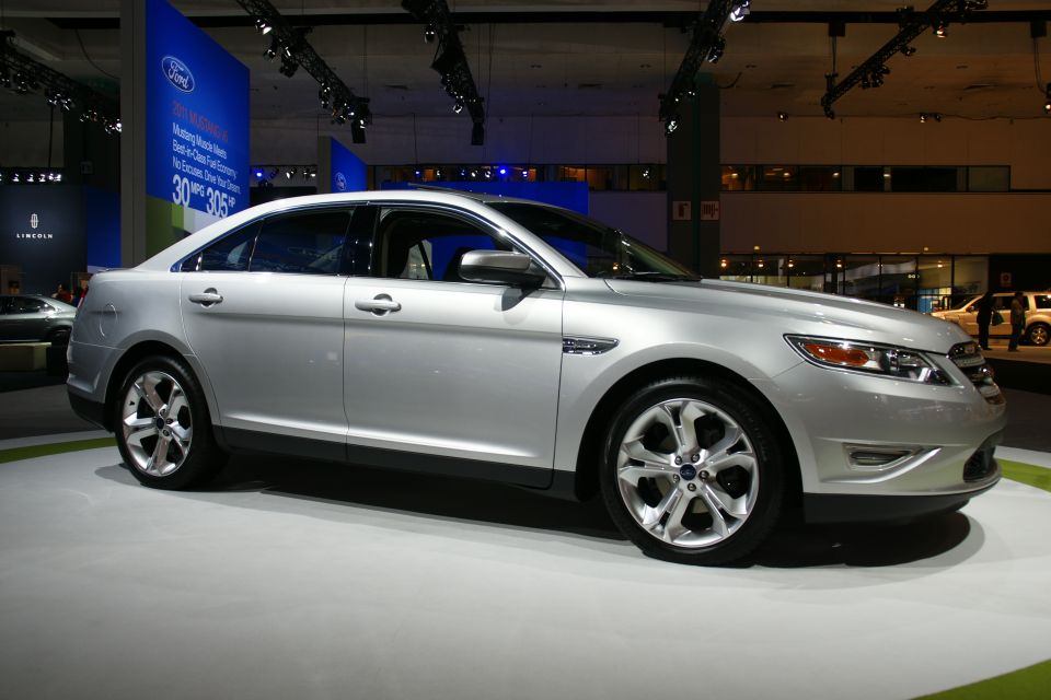 Silver sedan with a Ford badge on the grille, seen from the front three-quarter view