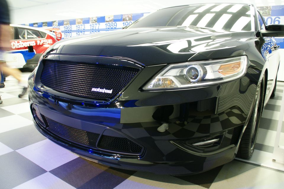 Black car front end with custom grille and headlights