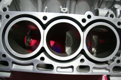 1993 Ford Taurus - Engine cylinder block with three bores, likely aluminum construction.