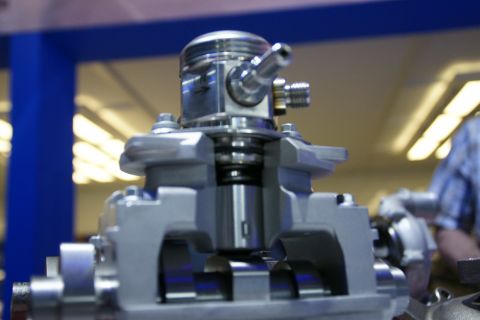 1993 Ford Taurus - Close-up of a cutaway engine piston assembly, revealing internal mechanical components.