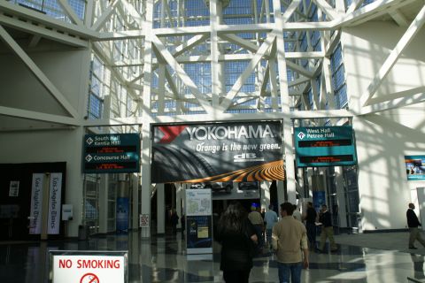 1993 Ford Taurus - Interior view of the Los Angeles Convention Center, showing signage and an advertisement.