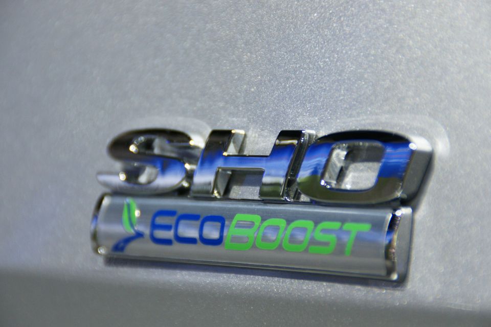Close-up of a chrome SHO badge with an EcoBoost emblem below it