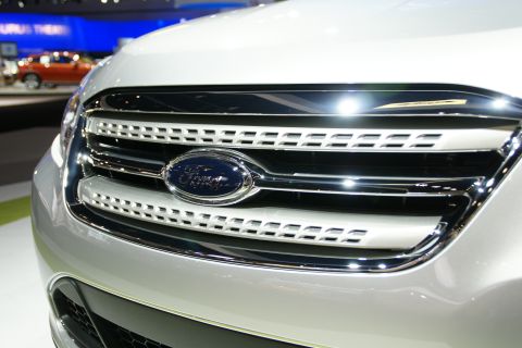 1993 Ford Taurus - The front grille of a modern Ford Taurus is shown at an auto show.