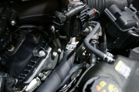 1993 Ford Taurus - A detailed view of the engine compartment, showing various mechanical parts and connections.