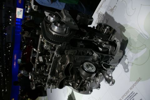 1993 Ford Taurus - A cutaway view of an EcoBoost engine is displayed, highlighting its internal components and technology.