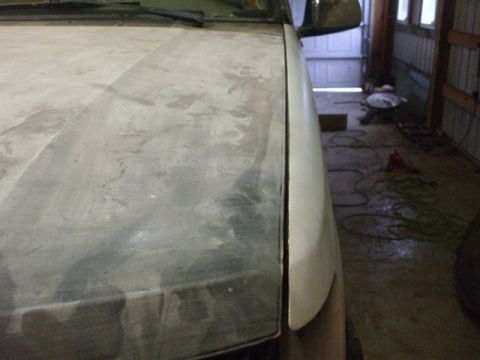 1995 Ford Bronco - Hood and fender panel gap on a vehicle undergoing bodywork.