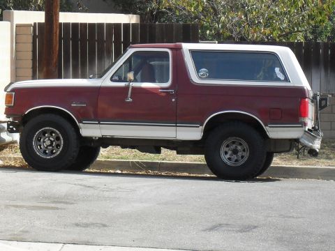 1989 Ford Bronco - side view parked across the street