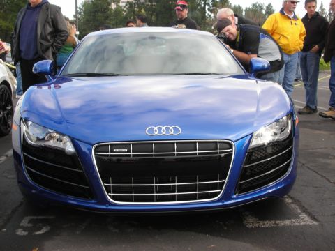 1998 Ford Crown Victoria - Front view of a blue Audi R8 with people gathered around.