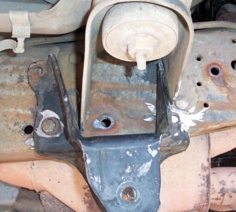 1990 Ford Bronco - Here's the same hanger moved forward after a few grinder mods :)