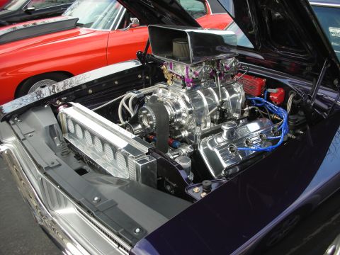 1998 Ford Crown Victoria - Custom supercharged V8 engine bay with chrome components and a prominent air intake.