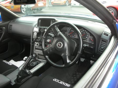 1998 Ford Crown Victoria - Interior view of a car with racing seats and aftermarket modifications.