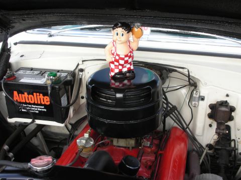 1998 Ford Crown Victoria - Big Boy figurine placed on the air cleaner assembly in the engine compartment.