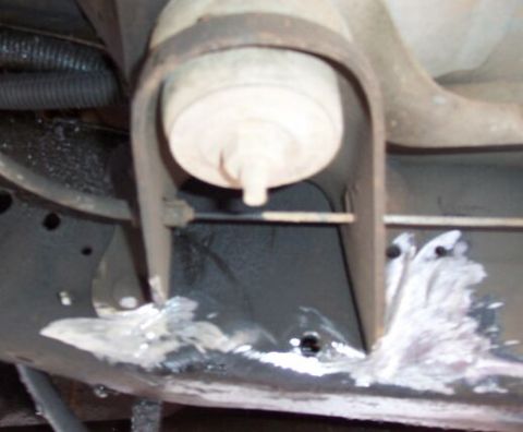 1990 Ford Bronco - ..... here's the same body mount after a little discussion with Mr. Grinder. This plus the mods to the hanger allow me to move it forward a…