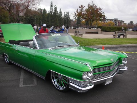1998 Ford Crown Victoria - This custom convertible is parked outside with its hood open, revealing the engine bay.