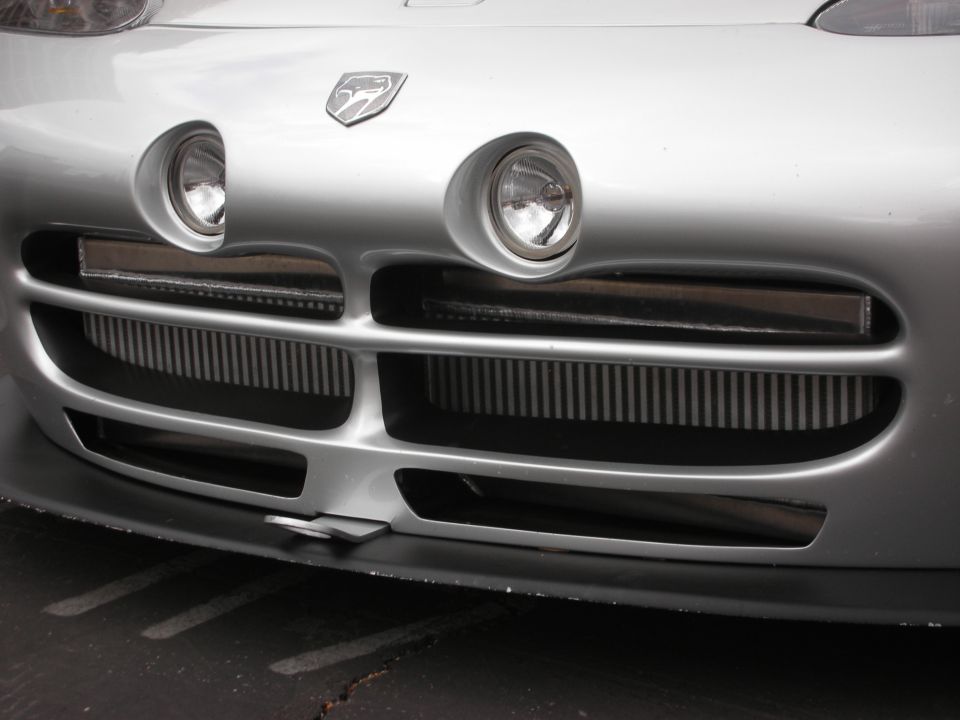 Silver Dodge Viper front grille, headlights, and badge