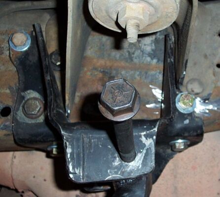 1990 Ford Bronco - A close-up of the above shot. Note the hole to the left is where the hanger originally WAS; my grinding and cutting netted me about 1" forw…