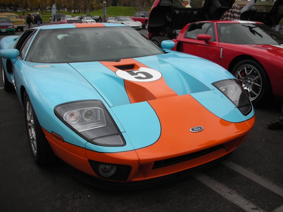 Light blue and orange Ford GT with racing stripes and the number 5 on the hood
