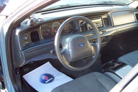 2001 Ford Crown Victoria - Interior view of a 2001 Ford Crown Victoria, showing the dashboard, steering wheel, and seats.