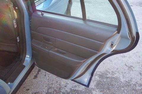 2001 Ford Crown Victoria - Interior view of the rear passenger door of a 2001 Ford Crown Victoria.