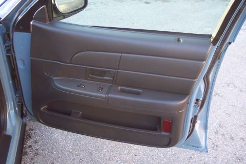 2001 Ford Crown Victoria - Interior view of a 2001 Ford Crown Victoria's driver's side door panel.