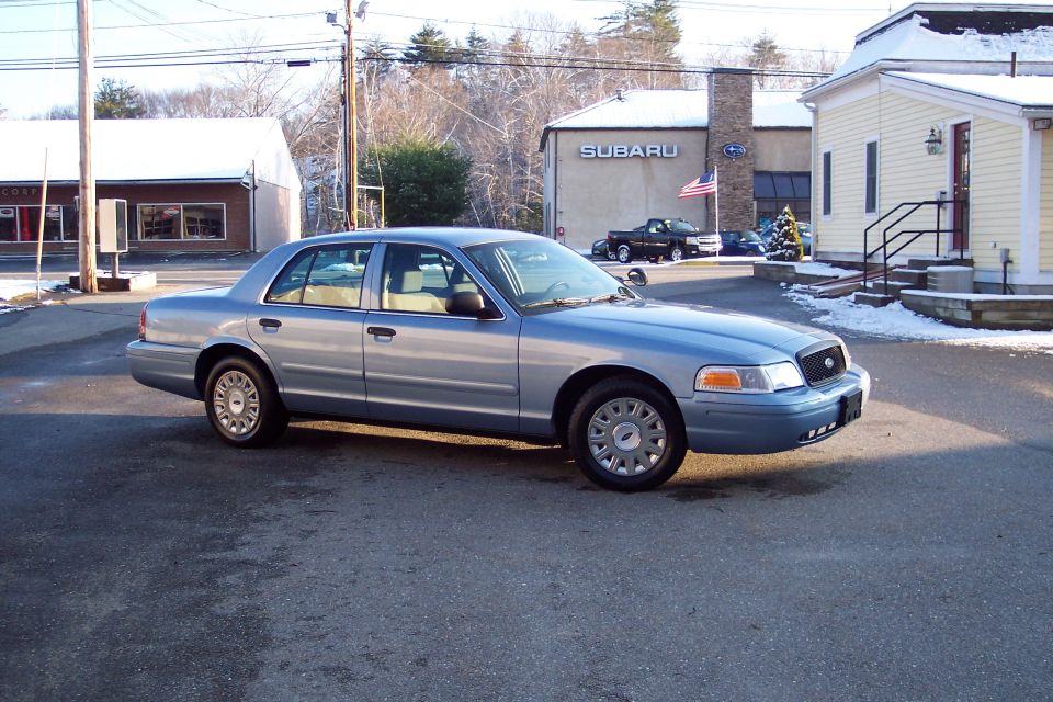 Silver sedan in motion, side view