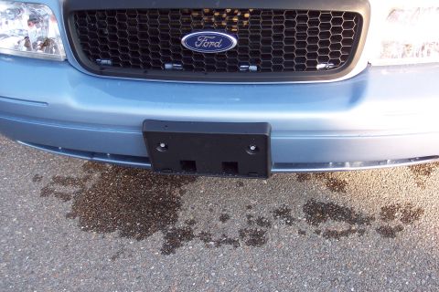 2001 Ford Crown Victoria - Front view of a 2001 Ford Crown Victoria, showing the grille and bumper area.