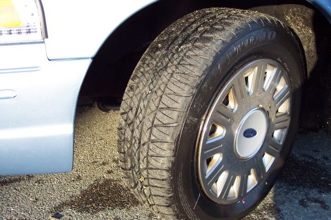 2001 Ford Crown Victoria - The Ford emblem is visible on the wheel hub of this Crown Victoria.