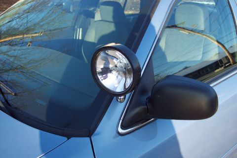 2001 Ford Crown Victoria - Interior view of a blue 2001 Ford Crown Victoria, showing a spotlight mounted on the A-pillar.