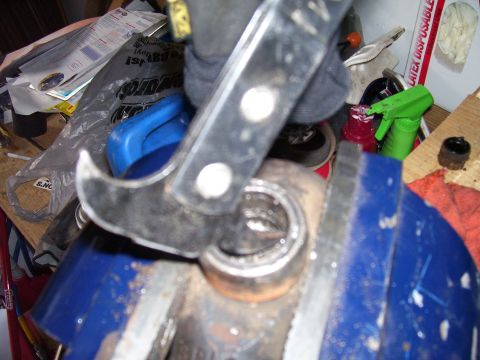 1991 Ford Bronco - Using a vise and tool to press a bearing into a housing.
