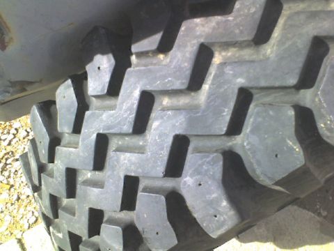 1981 Ford Bronco - A close-up view of a tire tread shows the "SUPERMOTORS" logo in the lower right corner.
