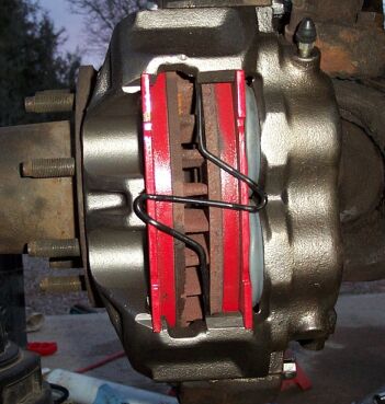 1990 Ford Bronco - Here's a loaded caliper installed with the anti-rattle clip